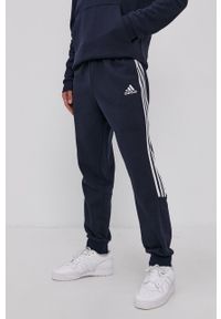 Adidas - adidas Spodnie GK8977 męskie kolor granatowy gładkie. Kolor: niebieski. Materiał: bawełna, materiał. Wzór: gładki #3