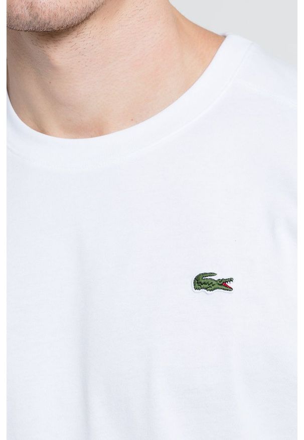 Lacoste - T-shirt. Okazja: na co dzień. Kolor: biały. Materiał: dzianina. Wzór: gładki. Styl: casual