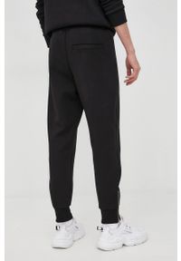 Hugo - HUGO spodnie dresowe męskie kolor czarny z nadrukiem. Kolor: czarny. Materiał: dresówka. Wzór: nadruk #2