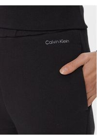 Calvin Klein Spodnie dresowe Metallic Micro Logo Jogger K20K206965 Czarny Regular Fit. Kolor: czarny. Materiał: syntetyk, bawełna