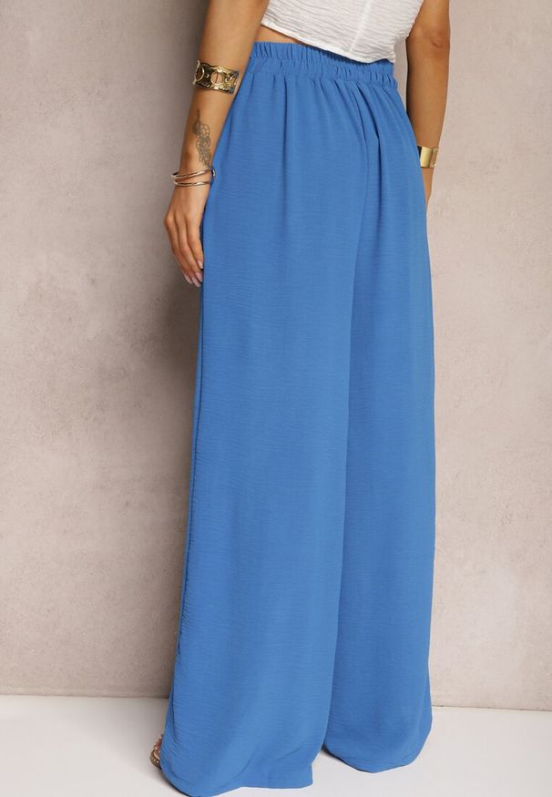 Renee - Niebieskie Spodnie w Stylu Alladynek High Waist Wykończone Gumką w Pasie Riselma. Okazja: na co dzień. Stan: podwyższony. Kolor: niebieski. Styl: sportowy, casual