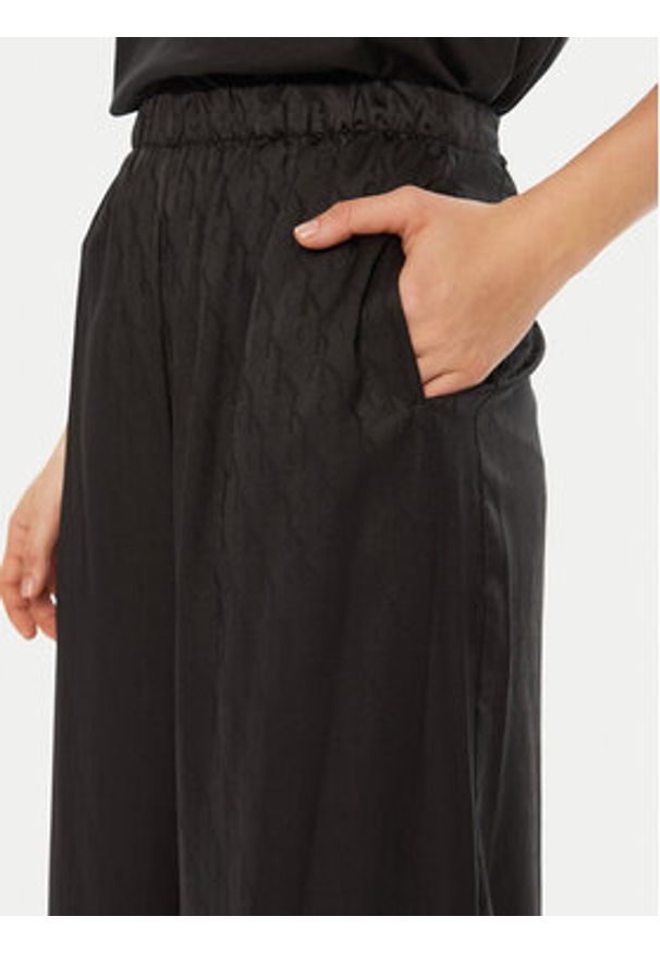 Calvin Klein Spodnie piżamowe 000QS7304E Czarny Relaxed Fit. Kolor: czarny. Materiał: syntetyk