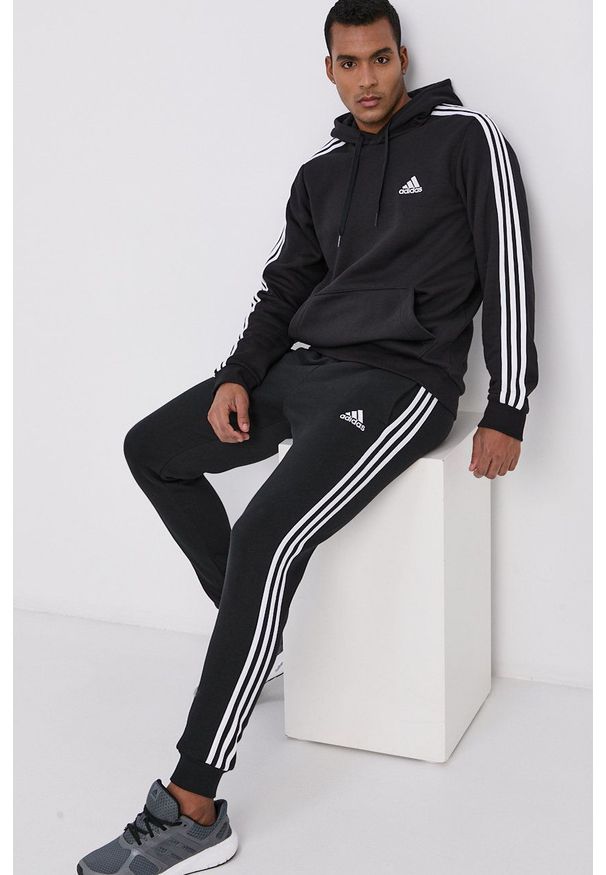 Adidas - adidas Spodnie GM1089 męskie kolor czarny gładkie. Kolor: czarny. Materiał: poliester, dzianina. Wzór: gładki