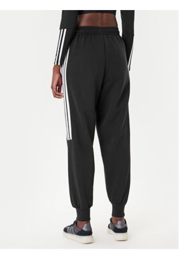 Adidas - adidas Spodnie dresowe Tiro 3-Stripes JL7488 Czarny Loose Fit. Kolor: czarny. Materiał: bawełna