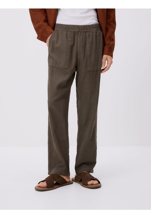 Reserved - Bawełniane spodnie jogger - brązowy. Kolor: brązowy. Materiał: bawełna