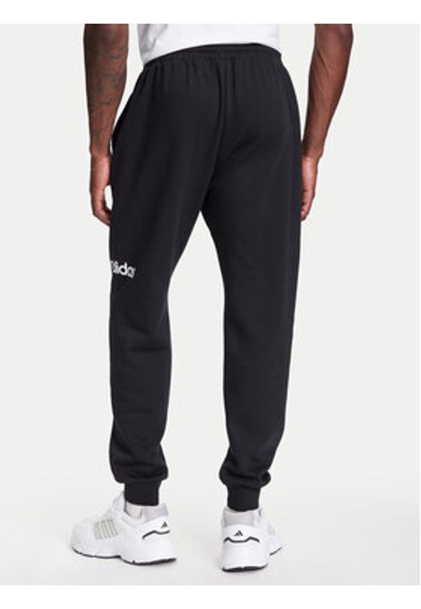 Adidas - adidas Spodnie dresowe Essentials Linear Fleece JN1786 Czarny Regular Fit. Kolor: czarny. Materiał: bawełna