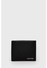 Calvin Klein - Portfel skórzany. Kolor: czarny. Materiał: materiał. Wzór: gładki #1