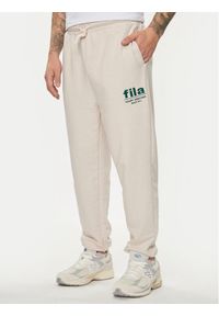 Fila Spodnie dresowe FAM0647 Beżowy Regular Fit. Kolor: beżowy. Materiał: bawełna