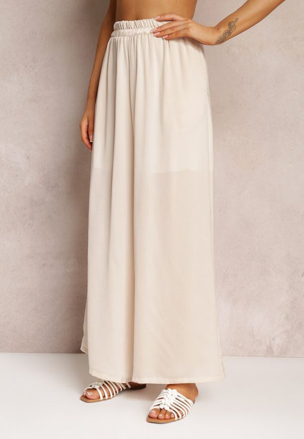 Renee - Jasnobeżowe Spodnie z Szerokimi Nogawkami i Gumką w Pasie Jacobisa. Stan: podwyższony. Kolor: beżowy