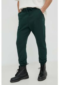 G-Star RAW - G-Star Raw spodnie dresowe kolor zielony gładkie. Kolor: zielony. Materiał: dresówka. Wzór: gładki
