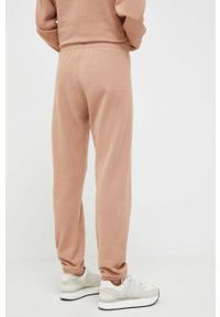 DKNY - Dkny spodnie dresowe kolor brązowy gładkie. Kolor: brązowy. Materiał: dresówka. Wzór: gładki #4