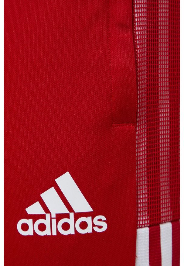 adidas Performance - Adidas Performance Spodnie męskie kolor czerwony z nadrukiem. Kolor: czerwony. Materiał: materiał. Wzór: nadruk