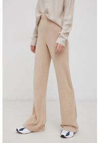 only - Only Spodnie damskie kolor beżowy dzwony high waist. Stan: podwyższony. Kolor: beżowy. Materiał: materiał