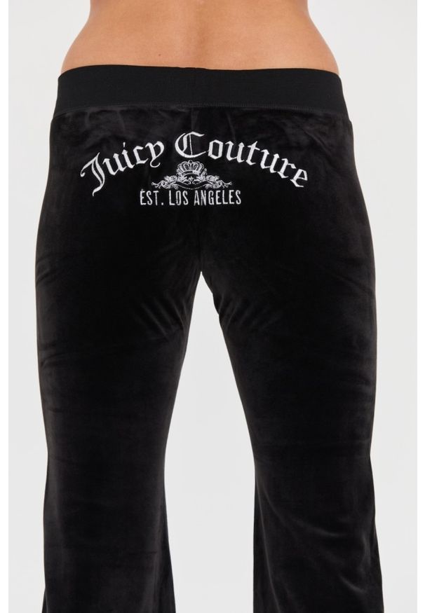 Juicy Couture - JUICY COUTURE Czarne spodnie Arched Metallic Layla. Kolor: czarny