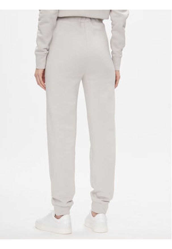 Calvin Klein Spodnie dresowe Metallic Micro Logo Jogger K20K206965 Beżowy Regular Fit. Kolor: beżowy. Materiał: bawełna, syntetyk