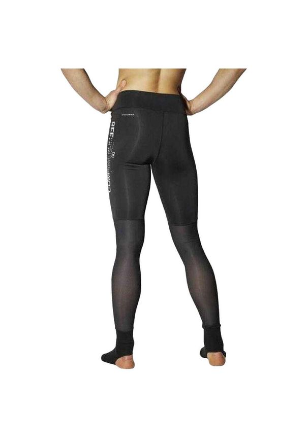 Reebok - Damskie Legginsy Ze Strzemiączkami Bojowymi. Kolor: czarny. Sport: turystyka piesza