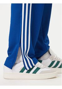 Adidas - adidas Spodnie dresowe adicolor Firebird KD4079 Niebieski Regular Fit. Kolor: niebieski. Materiał: syntetyk #3