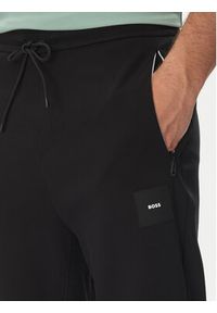 BOSS Spodnie dresowe Hadiko 50537198 Czarny Regular Fit. Kolor: czarny. Materiał: bawełna #4