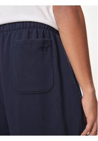 Under Armour Spodnie dresowe UA Icon 1386551 Granatowy Loose Fit. Kolor: niebieski. Materiał: bawełna