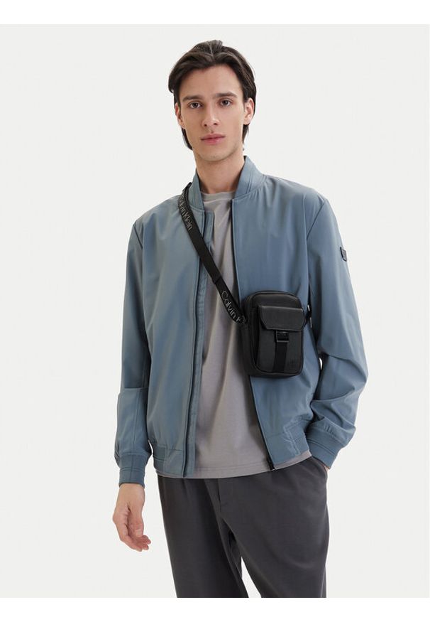 Calvin Klein Saszetka Webbing Strap Slim Reporter LV04D3281G Czarny. Kolor: czarny. Materiał: skóra