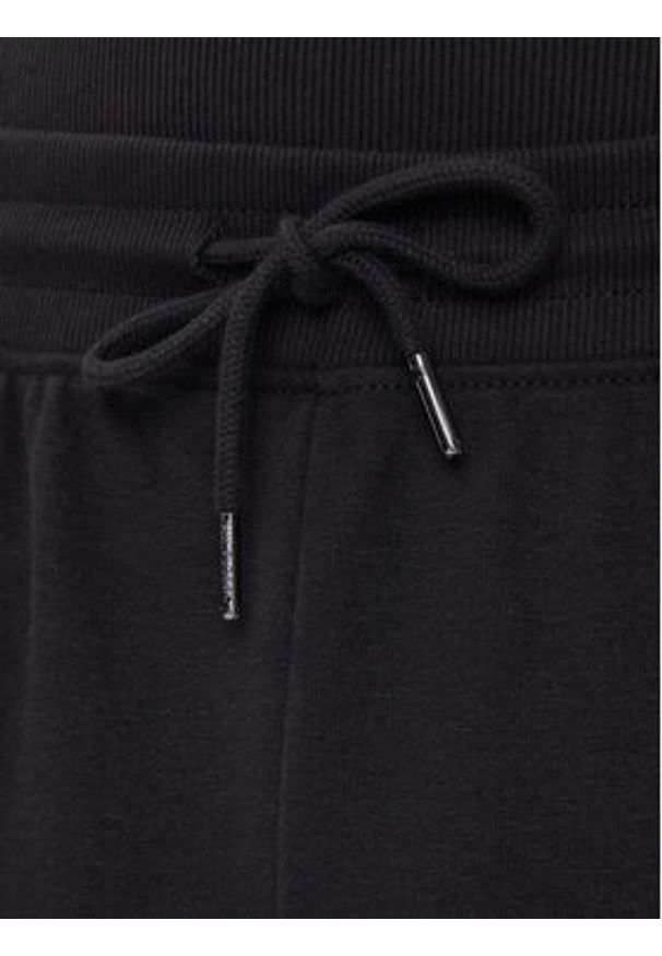TOMMY HILFIGER - Tommy Hilfiger Spodnie dresowe UM0UM03664 Czarny Regular Fit. Kolor: czarny. Materiał: bawełna