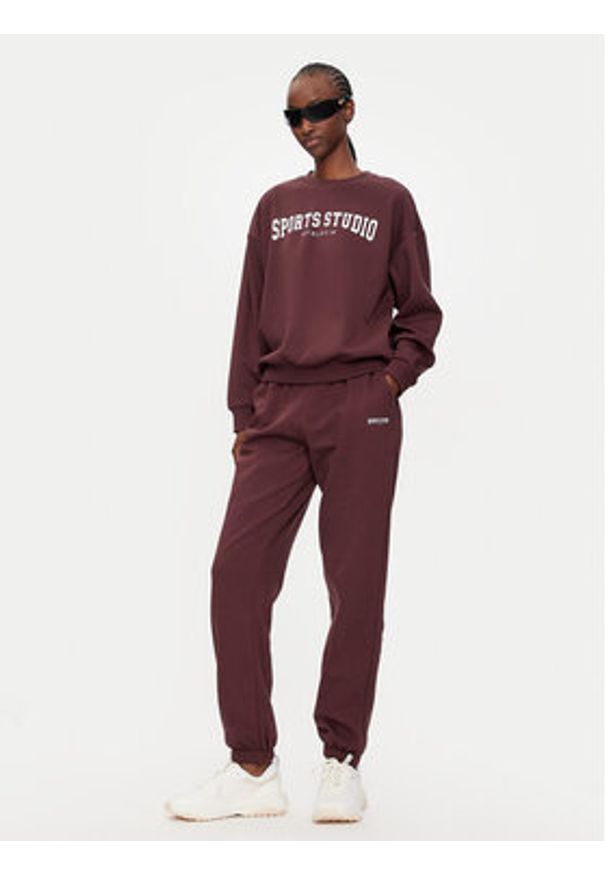 Athlecia Spodnie dresowe Giannis W Sweat EA243382 Bordowy Regular Fit. Kolor: czerwony. Materiał: bawełna, syntetyk