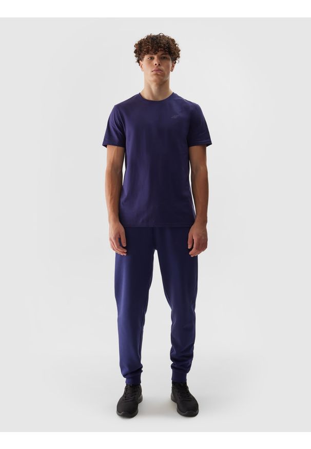 4f - Spodnie dresowe joggery męskie - granatowe. Kolor: niebieski. Materiał: dresówka. Wzór: ze splotem, jednolity, gładki