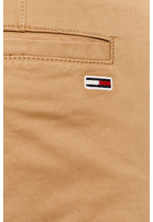 Tommy Jeans - Spodnie. Kolor: beżowy