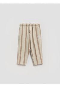 Reserved - Dresowe spodnie oversize - brązowy. Kolor: brązowy. Materiał: dresówka #1