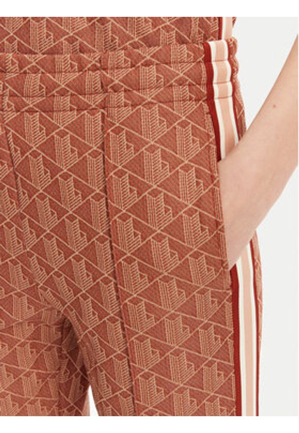 Lacoste Spodnie dresowe XF9313 Pomarańczowy Regular Fit. Kolor: pomarańczowy. Materiał: bawełna, syntetyk