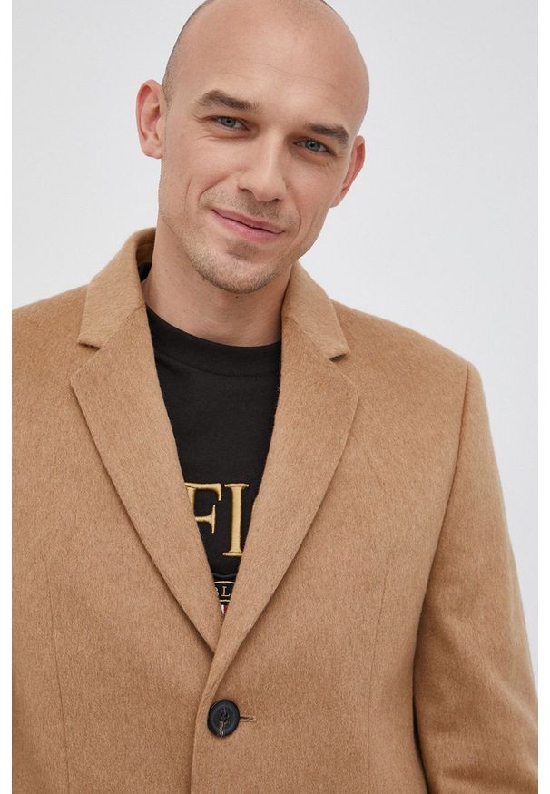TOMMY HILFIGER - Tommy Hilfiger Płaszcz wełniany kolor beżowy przejściowy. Okazja: na co dzień. Kolor: beżowy. Materiał: wełna. Styl: casual, klasyczny