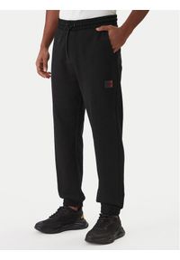 Hugo - HUGO Spodnie dresowe Danopan 50553146 Czarny Relaxed Fit. Kolor: czarny. Materiał: bawełna #1