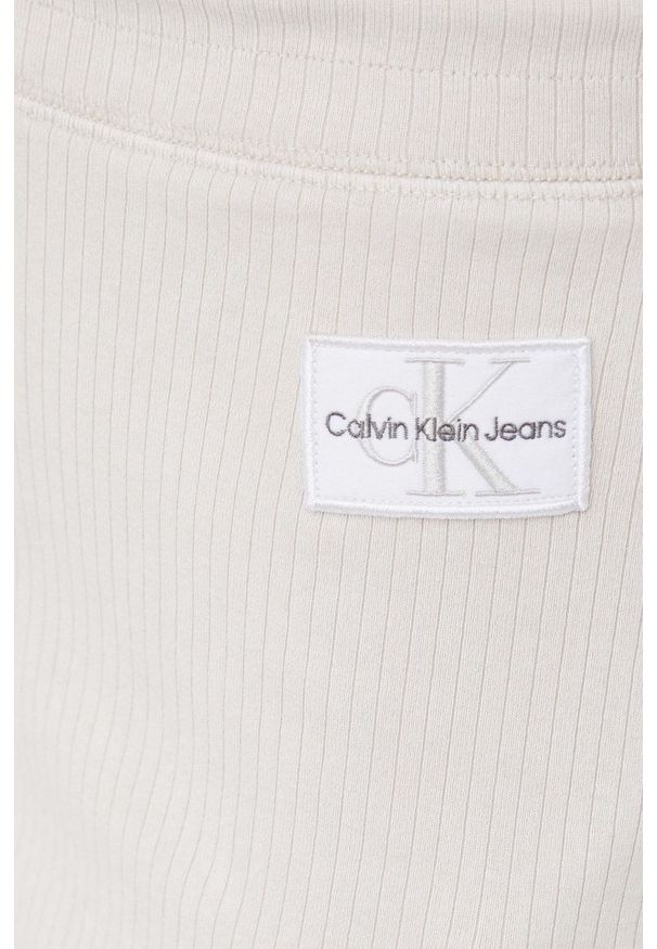 Calvin Klein Jeans spódnica kolor beżowy midi prosta. Okazja: na co dzień. Stan: podwyższony. Kolor: beżowy. Materiał: dzianina. Styl: casual