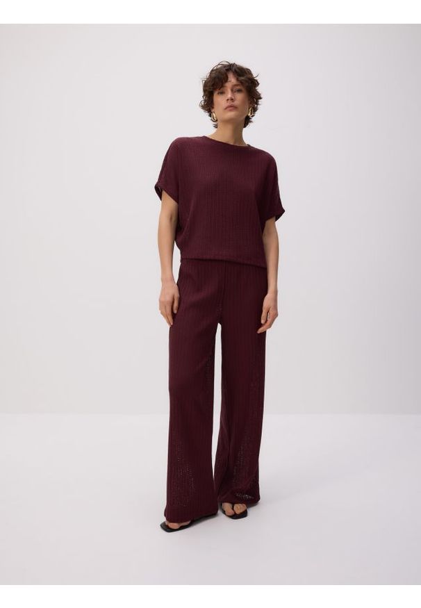 Reserved - Dzianinowe spodnie - bordowy. Kolor: czerwony. Materiał: dzianina