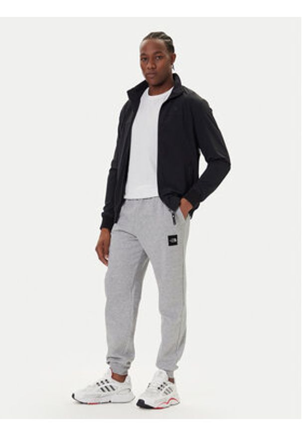 The North Face Spodnie dresowe Fine NF0A8C1K Szary Tapered Fit. Kolor: szary. Materiał: bawełna
