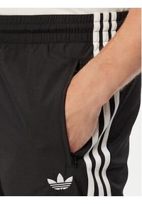 Adidas - adidas Spodnie dresowe Firebird Woven KE1371 Czarny Regular Fit. Kolor: czarny. Materiał: syntetyk #8