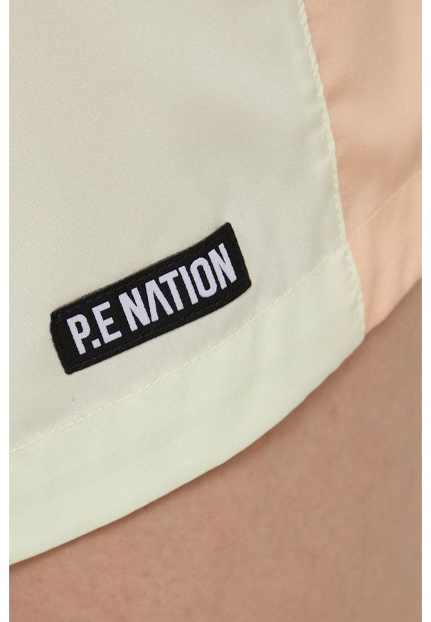 P.E Nation szorty damskie kolor żółty gładkie medium waist. Okazja: na co dzień. Kolor: żółty. Materiał: tkanina. Wzór: gładki. Styl: casual