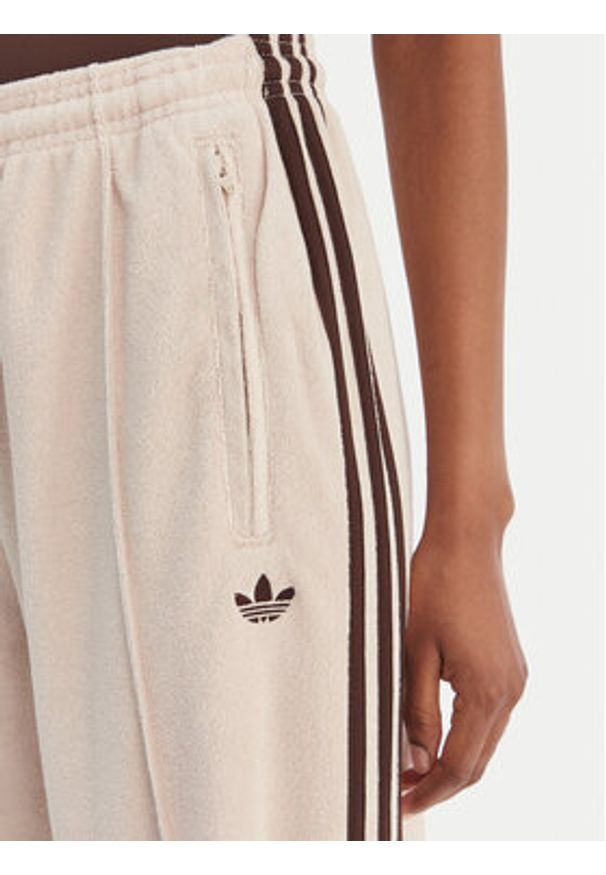 Adidas - adidas Spodnie dresowe Terry Towel Firebird KQ6661 Beżowy Loose Fit. Kolor: beżowy. Materiał: bawełna