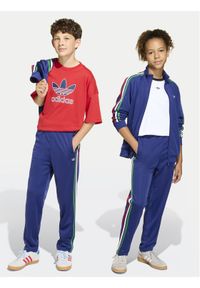 Adidas - adidas Spodnie dresowe Firebird KC9503 Niebieski Regular Fit. Kolor: niebieski. Materiał: syntetyk #1