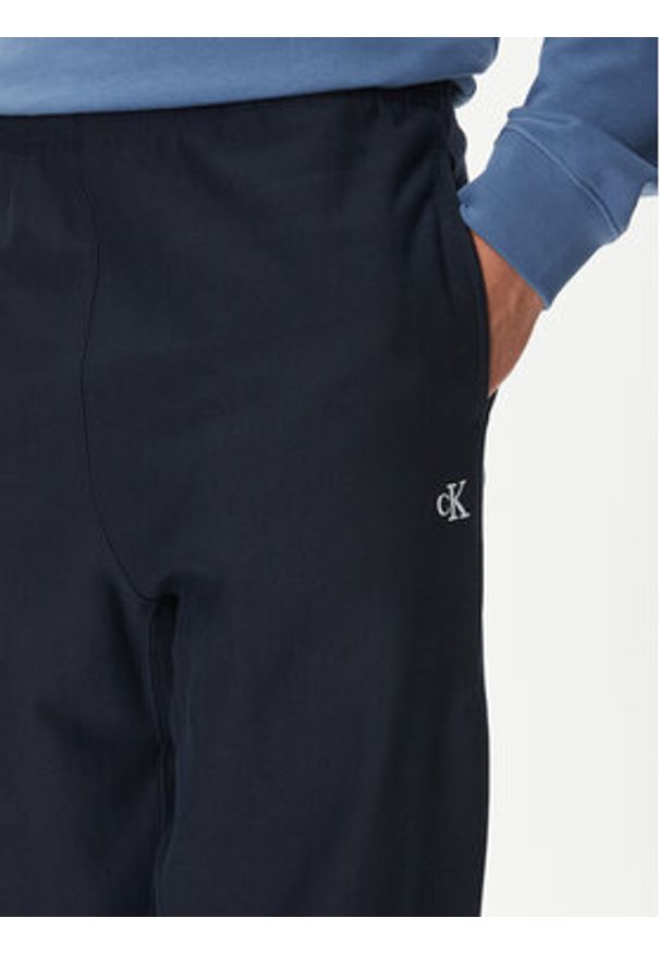 Calvin Klein Jeans Spodnie dresowe Premium LV04RC279G Granatowy Regular Fit. Kolor: niebieski. Materiał: bawełna