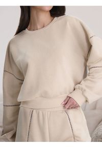 Sinsay - Bluza z ażurowymi detalami - kremowy. Kolor: kremowy. Wzór: ażurowy