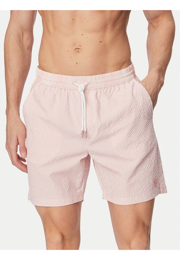 Guess Szorty kąpielowe F6GT11 WN342 Różowy jasny Regular Fit. Kolor: różowy. Materiał: syntetyk