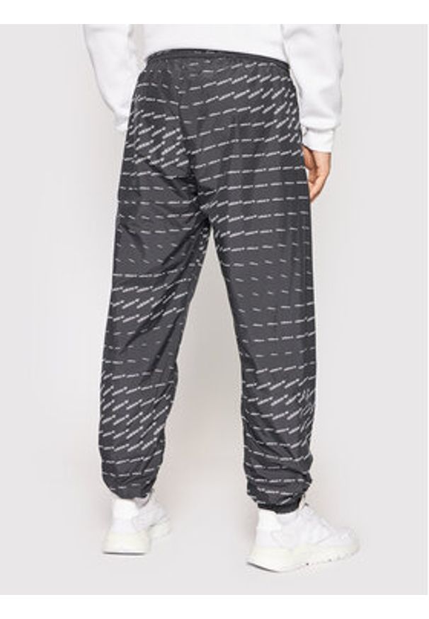 Adidas - adidas Spodnie dresowe Graphics Monogram H13484 Czarny Regular Fit. Kolor: czarny. Materiał: syntetyk, dresówka