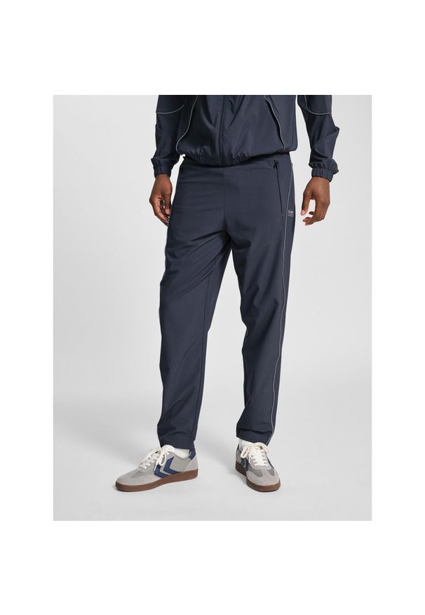 Spodnie dresowe tkane Hummel Pulse. Kolor: wielokolorowy, szary, czarny, brązowy. Materiał: dresówka. Sport: fitness