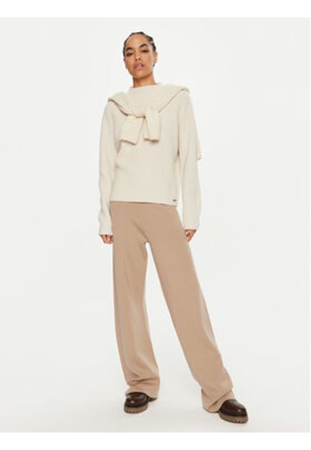 Calvin Klein Spodnie dresowe K20K207680 Beżowy Relaxed Fit. Kolor: beżowy. Materiał: wełna