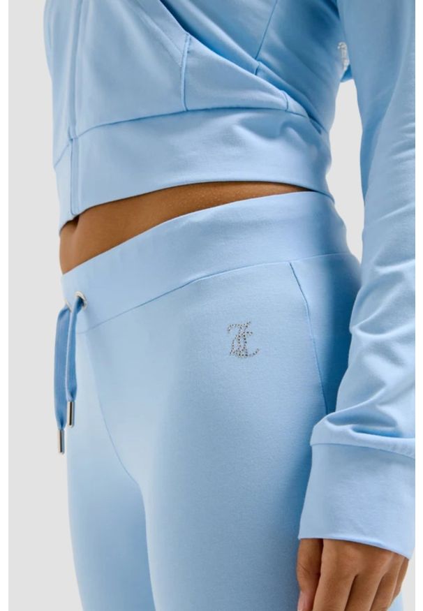 Juicy Couture - JUICY COUTURE Błękitne damskie spodnie dresowe Single Jersey Apollo Low Rise, Rozmiar S. Kolor: niebieski. Materiał: jersey, dresówka