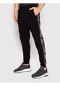 Guess Spodnie dresowe Z2YB19 K6ZS1 Czarny Regular Fit. Kolor: czarny. Materiał: bawełna #1