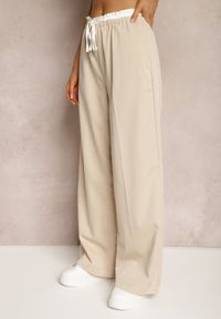 Renee - Jasnobeżowe Materiałowe Spodnie z Szerokimi Nogawkami High Waist z Gumką w Talii Comina. Okazja: na co dzień. Stan: podwyższony. Kolor: beżowy. Materiał: materiał. Styl: casual, elegancki #4