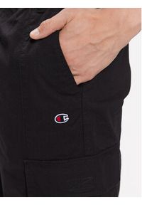 Champion Spodnie dresowe 218739 Czarny Regular Fit. Kolor: czarny. Materiał: bawełna, dresówka #4