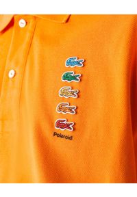 Lacoste - LACOSTE - Pomarańczowa koszulka polo z logo Regular Fit. Typ kołnierza: polo. Kolor: pomarańczowy. Materiał: bawełna. Wzór: haft, prążki, aplikacja. Sezon: wiosna #2